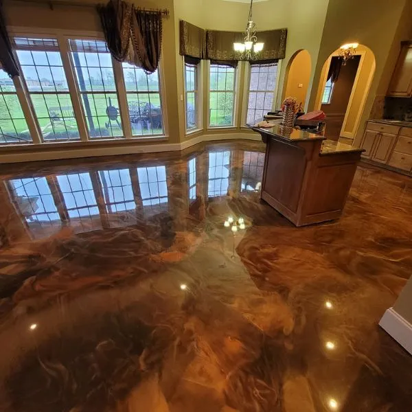 Marbled metallic epoxy floor with flowing reflective pigment in a Collier County interior
